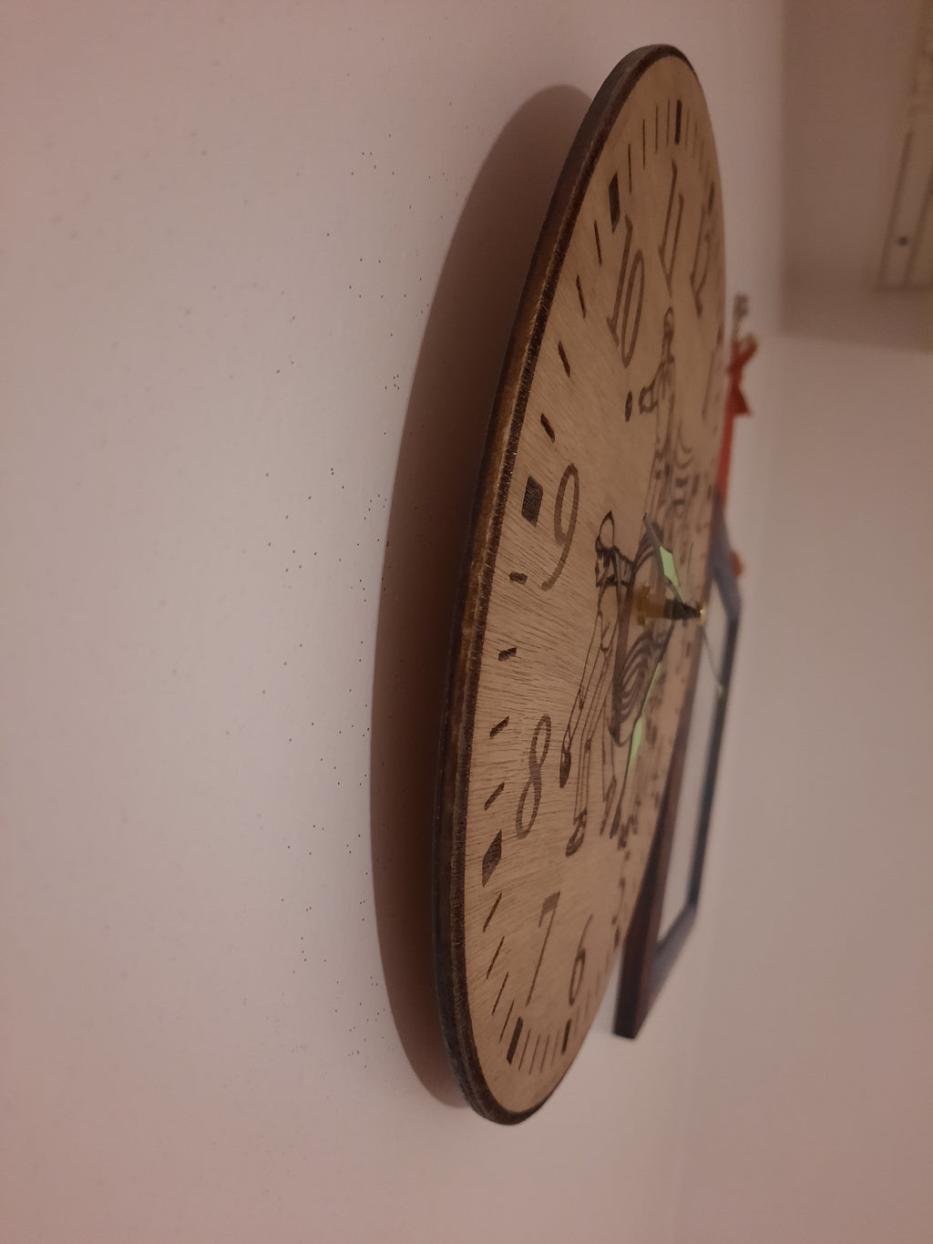 Pendule en bois pentanque
